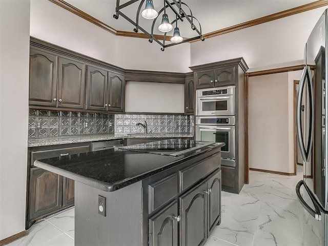 kitchen with black electric stovetop, backsplash, fridge, dark brown cabinets, and a kitchen island