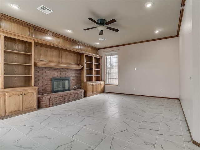 unfurnished living room with a brick fireplace, ornamental molding, ceiling fan, and built in shelves