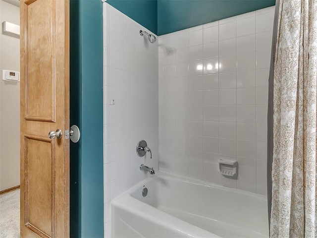 bathroom with shower / bathtub combination with curtain