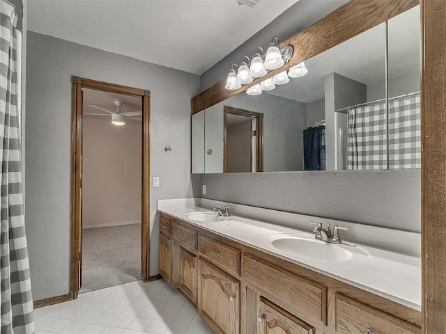 bathroom featuring ceiling fan and vanity