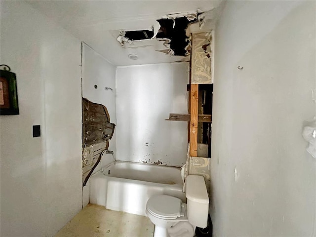 bathroom with toilet and a tub to relax in