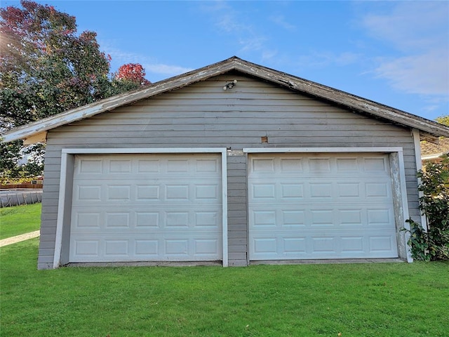 garage with a yard