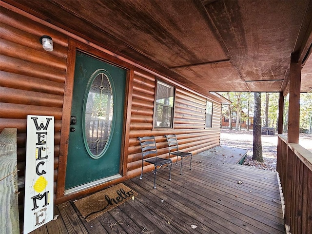 doorway to property featuring covered porch