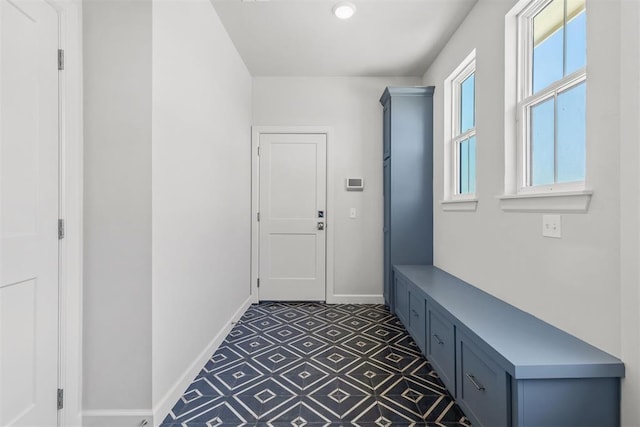 mudroom featuring baseboards and tile patterned floors