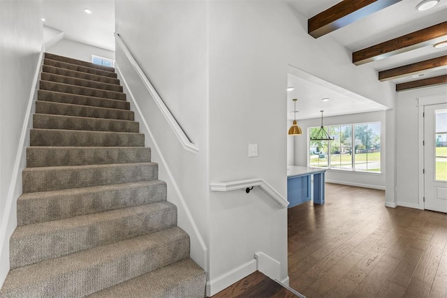 stairs featuring recessed lighting, wood-type flooring, beam ceiling, and baseboards