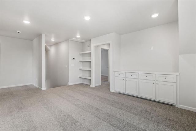 spare room with carpet, baseboards, and recessed lighting