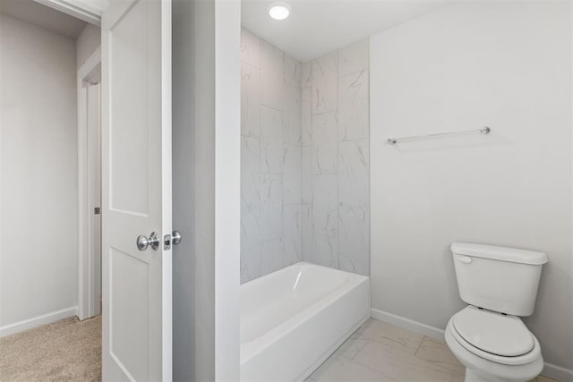 bathroom with marble finish floor, baseboards, toilet, and bathtub / shower combination