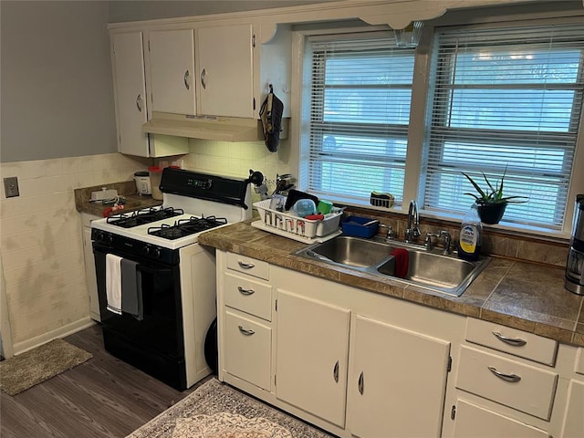 kitchen with white cabinets, dark hardwood / wood-style flooring, sink, and white range with gas cooktop