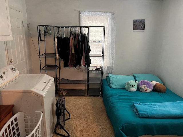 carpeted bedroom featuring washer / dryer