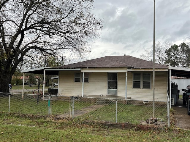 rear view of property with a carport