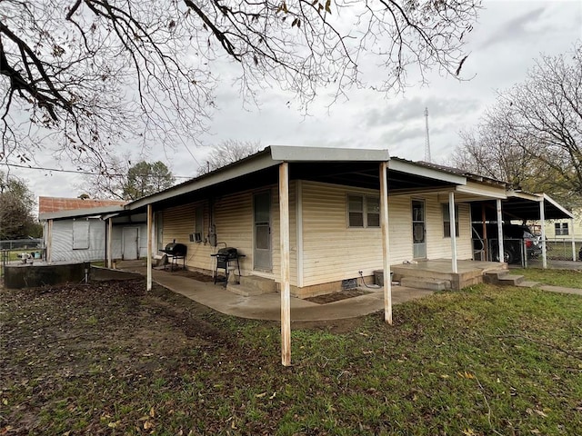 view of side of home featuring a patio area