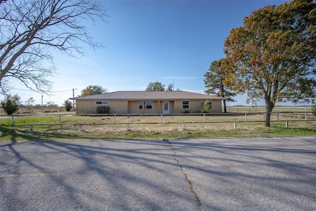 single story home with a rural view