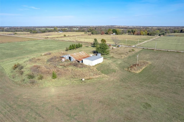 birds eye view of property featuring a rural view