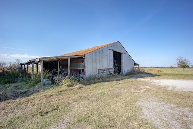 view of outdoor structure featuring a rural view