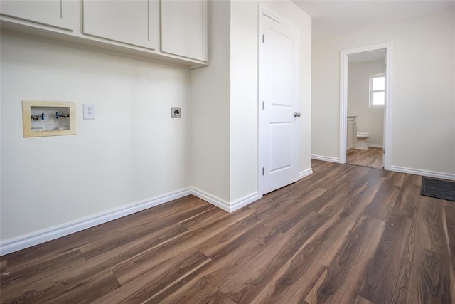 laundry area featuring hookup for an electric dryer, washer hookup, cabinets, and dark wood-type flooring