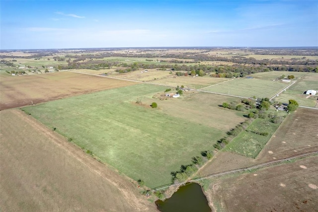 drone / aerial view with a rural view and a water view