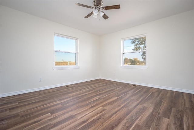 empty room featuring dark hardwood / wood-style floors and ceiling fan