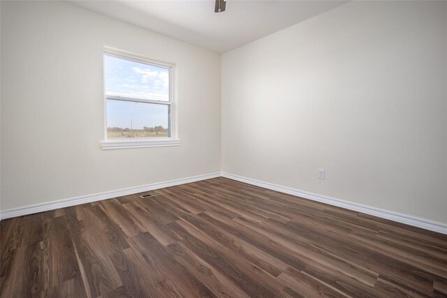 unfurnished room featuring dark hardwood / wood-style floors