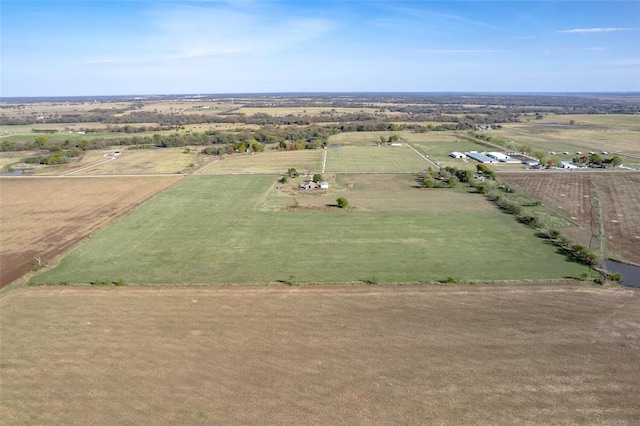 birds eye view of property with a rural view