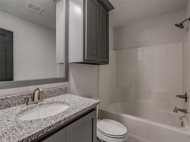 full bathroom featuring vanity, toilet, and washtub / shower combination