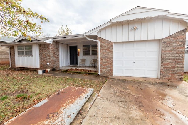 single story home with covered porch and a garage