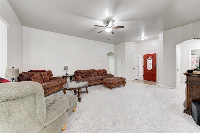 living room with ceiling fan and light colored carpet