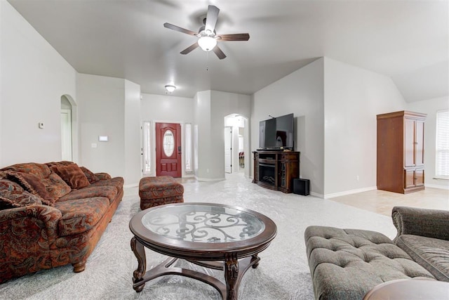 living room with ceiling fan and lofted ceiling