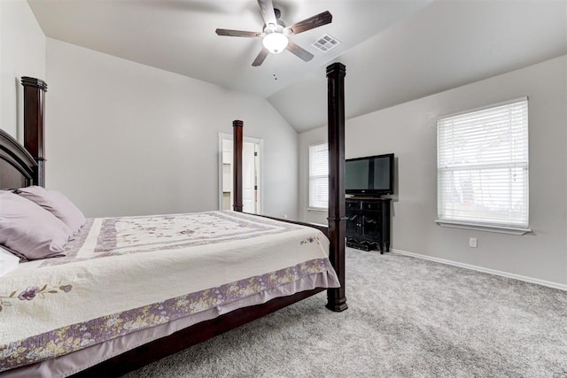 carpeted bedroom with ceiling fan and lofted ceiling