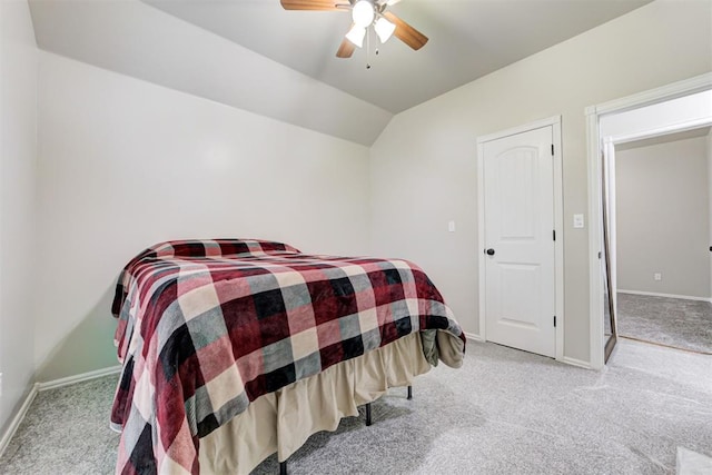 carpeted bedroom featuring ceiling fan and lofted ceiling