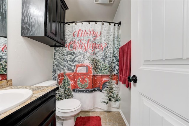 bathroom with a shower with shower curtain, tile patterned floors, vanity, and toilet