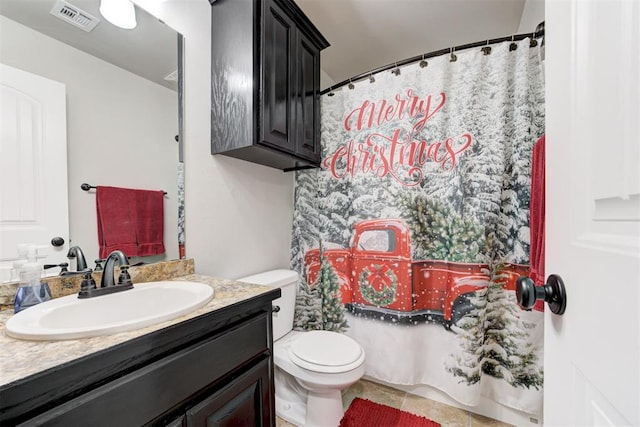 bathroom featuring vanity, toilet, and walk in shower