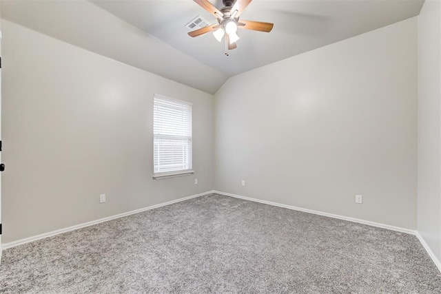 carpeted empty room featuring ceiling fan and lofted ceiling