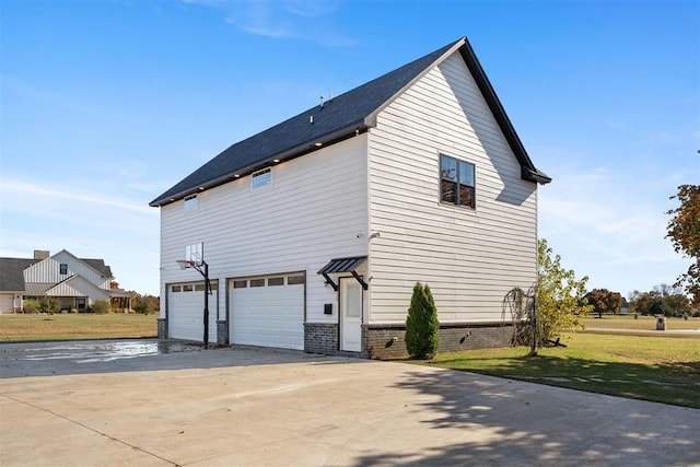 view of home's exterior with a lawn and a garage