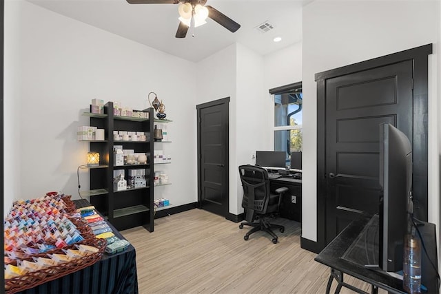 office area featuring light hardwood / wood-style flooring and ceiling fan