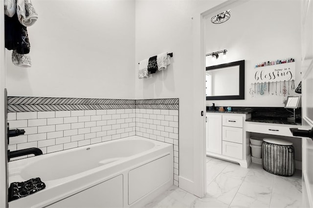 bathroom with vanity and a tub to relax in