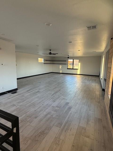 unfurnished room featuring ceiling fan and light hardwood / wood-style floors