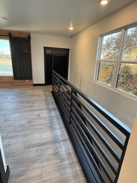 hallway with light wood-type flooring