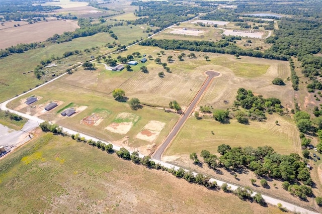 birds eye view of property featuring a rural view