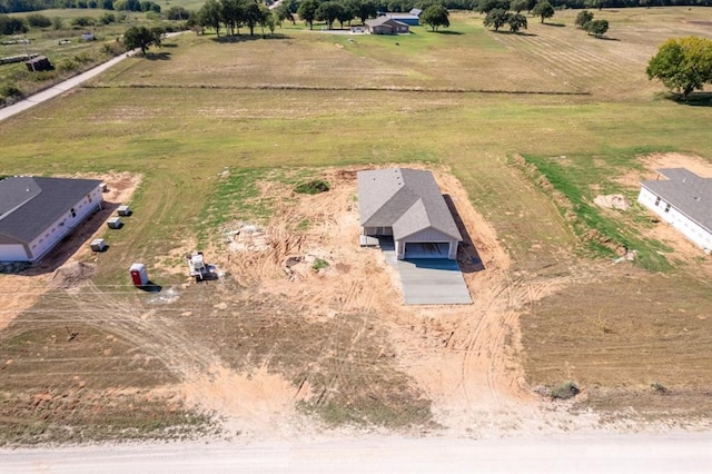 birds eye view of property featuring a rural view