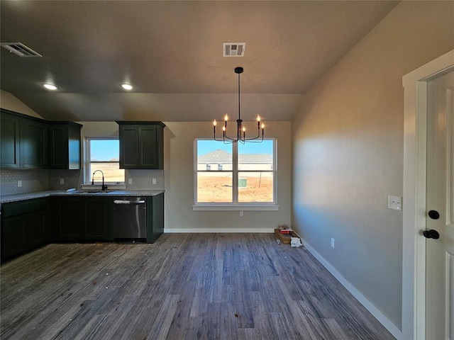 kitchen with backsplash, stainless steel dishwasher, vaulted ceiling, and a notable chandelier