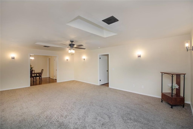 carpeted empty room featuring ceiling fan