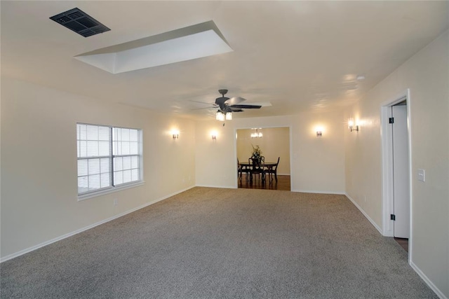 spare room featuring carpet and ceiling fan