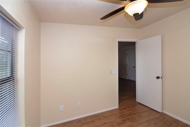 unfurnished bedroom with hardwood / wood-style floors and ceiling fan