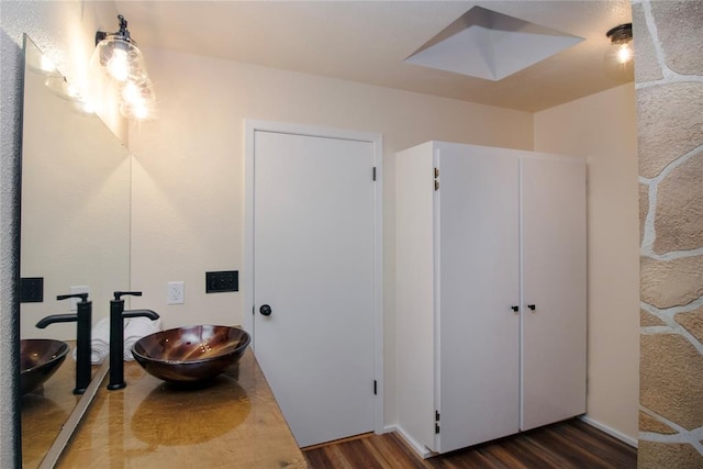 bathroom featuring hardwood / wood-style floors and sink