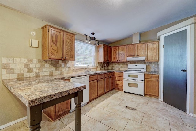 kitchen featuring tasteful backsplash, kitchen peninsula, lofted ceiling, white appliances, and light tile patterned flooring