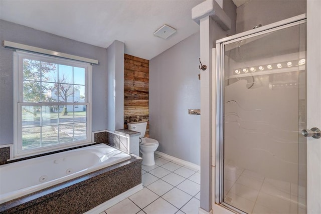 bathroom with tile patterned flooring, wooden walls, toilet, and plus walk in shower