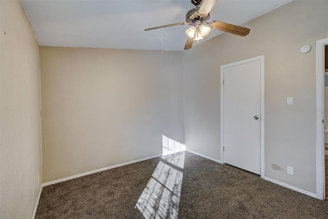 carpeted spare room with ceiling fan and lofted ceiling