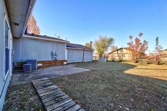 view of yard with a patio and central AC unit