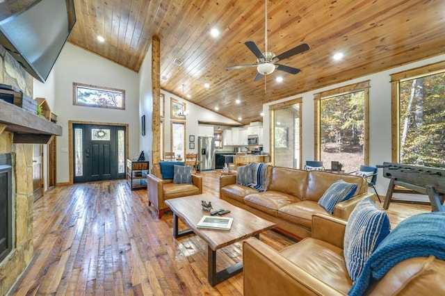 living room with ceiling fan, light hardwood / wood-style flooring, high vaulted ceiling, and wooden ceiling