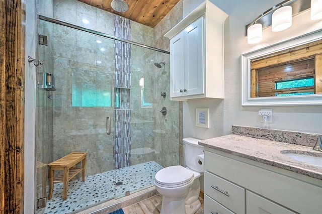 bathroom with hardwood / wood-style floors, vanity, toilet, an enclosed shower, and wood ceiling